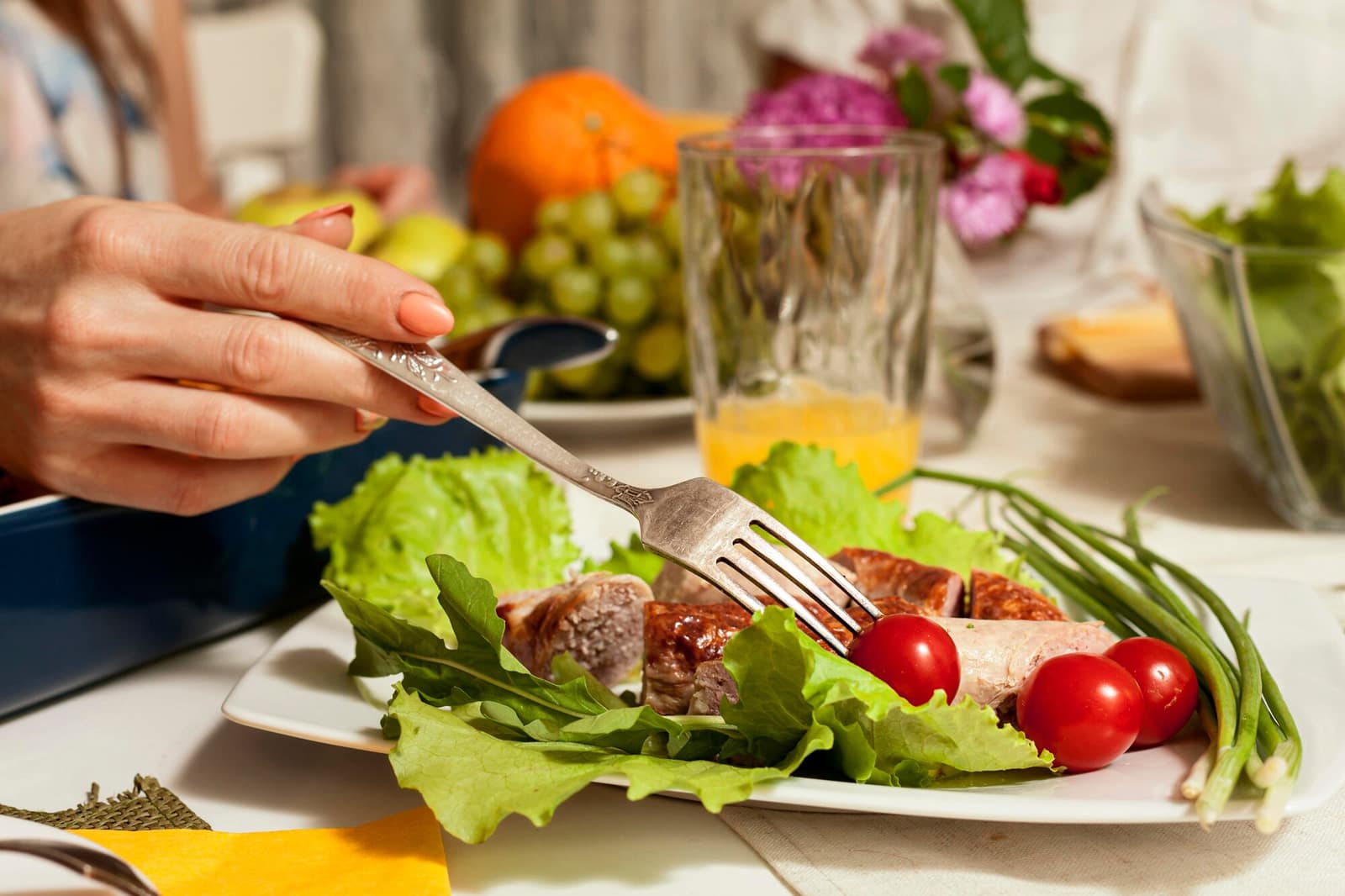 Side view of a healthy dish with fork and vegetables